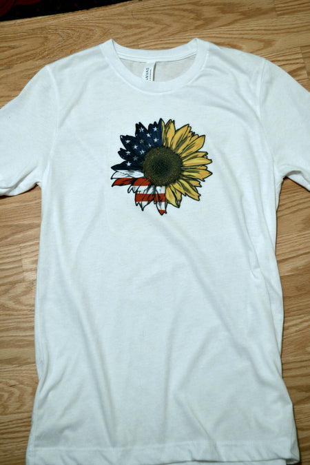 White t shirt with half American flag and half sunflower sublimation on front.